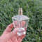 Bottiglia operata di lusso 55ml di vetro del profumo di progettazione della dogana con lo spruzzatore del cappuccio della pompa