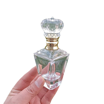 Bottiglia operata di lusso 55ml di vetro del profumo di progettazione della dogana con lo spruzzatore del cappuccio della pompa