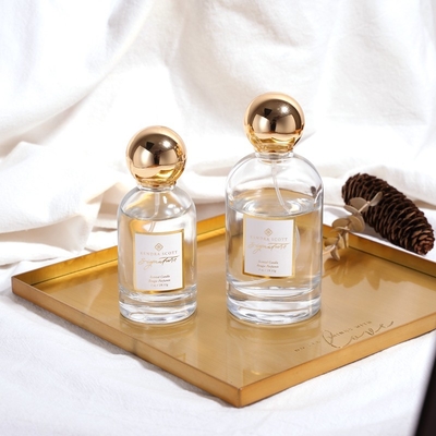 Bottiglia di profumo di lusso di vetro dell'OEM dell'oro rotondo vuoto di Zamac 50ML 100ML